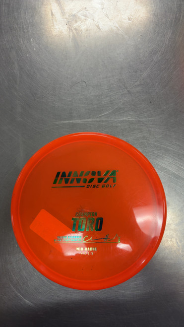Vist Large View of Product Image Which is Used Innova CHAMPION TORO Disc Golf Mid Range Orange