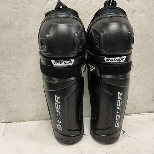 Vist Large View of Product Image Which is Used Bauer X Junior Shin Guards Black And Royal Blue 11"