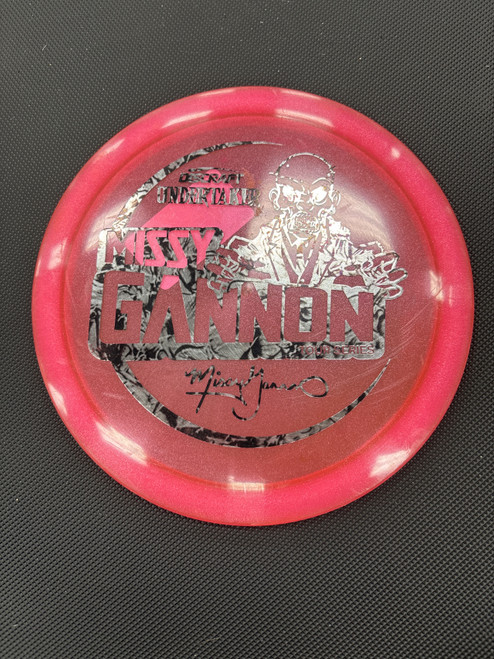 Vist Large View of Product Image Which is Used Discraft TOUR SERIES UNDERTAKER GANNON Disc Golf Driver Pink