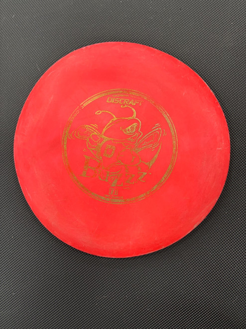 Vist Large View of Product Image Which is Used Discraft PRO D BUZZZ Disc Golf Mid Range Red
