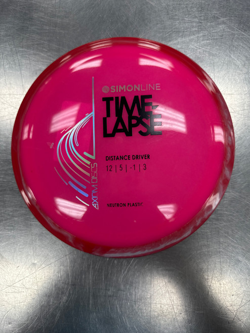 Vist Large View of Product Image Which is Used Axiom NEUTRON TIME LAPSE Disc Golf Driver Pink