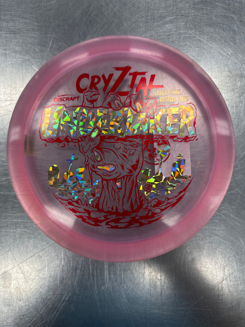 Vist Large View of Product Image Which is Used Discraft CRYZTAL UNDERTAKER Disc Golf Driver Pink