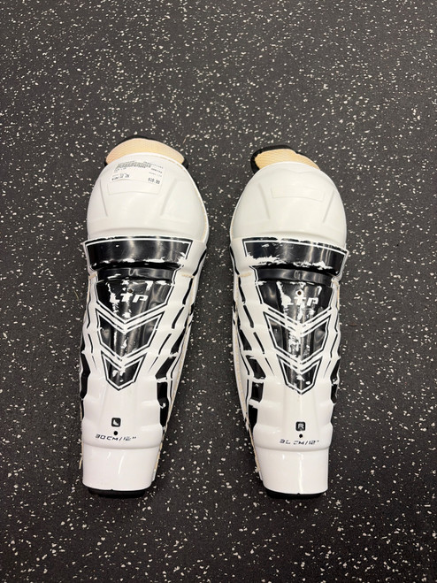 Vist Large View of Product Image Which is Used CCM LTP Senior Shin Guards White 12"