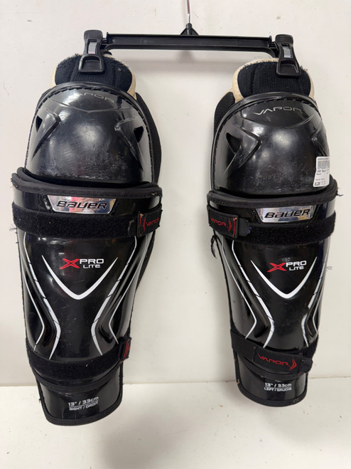 Vist Large View of Product Image Which is Used Bauer VAPOR X PRO LITE Junior Shin Guards Black 13"