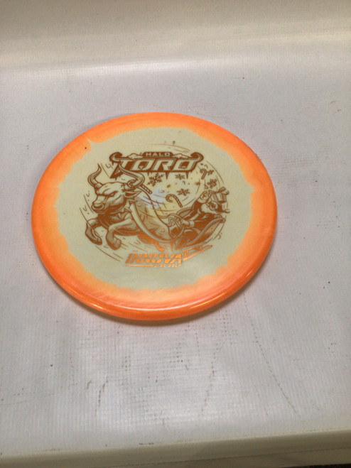 Vist Large View of Product Image Which is Used Innova HALO TORRO Disc Golf Mid Range Orange