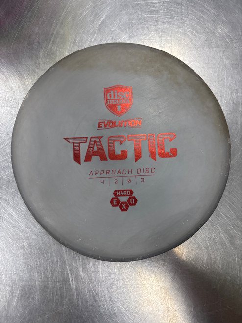 Vist Large View of Product Image Which is Used Discmania EXO HARD TACTIC Disc Golf Mid Range Grey
