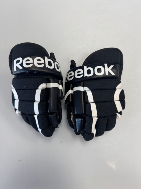 Vist Large View of Product Image Which is Used Reebok CROSBY Youth Gloves Black 8"