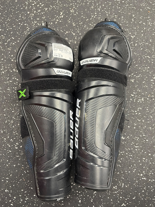 Vist Large View of Product Image Which is Used Bauer BAUER X SHIN GUARD Junior Shin Guards Black 12"