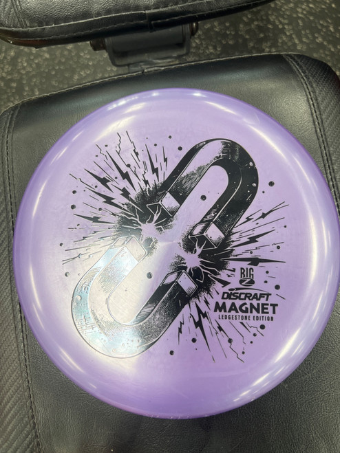 Vist Large View of Product Image Which is Used Discraft MAGNET LEDGESTONE Disc Golf Putter Purple