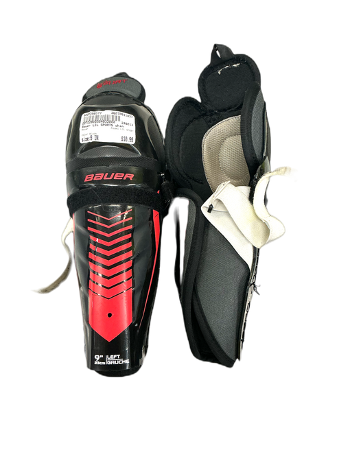 Vist Large View of Product Image Which is Used Bauer LIL SPORT Youth Shin Guards Black 9"