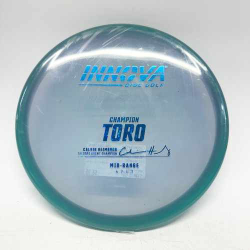 Vist Large View of Product Image Which is Used Innova CHAMPION TORO Disc Golf Mid Range Teal 172g