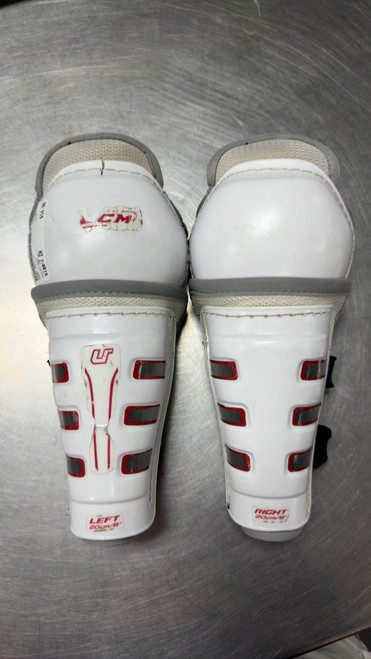Vist Large View of Product Image Which is Used CCM U+ Youth Shin Guards White 8"