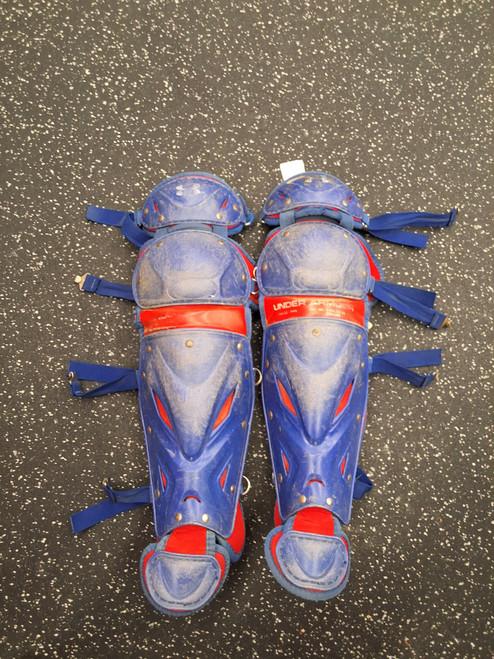 Vist Large View of Product Image Which is Used Under Armour UALG2-JRVS Catchers Leg Guards Navy Blue Junior