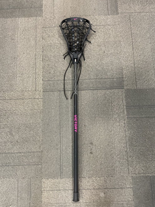 Vist Large View of Product Image Which is Used Nike VICTORY ARISE STICK Wmn Atk/Mid Complete Stick Black
