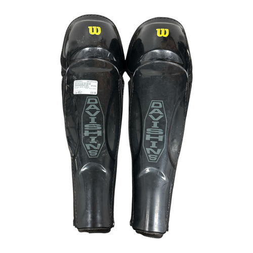Vist Large View of Product Image Which is Used Wilson Catchers Leg Guards Black Adult