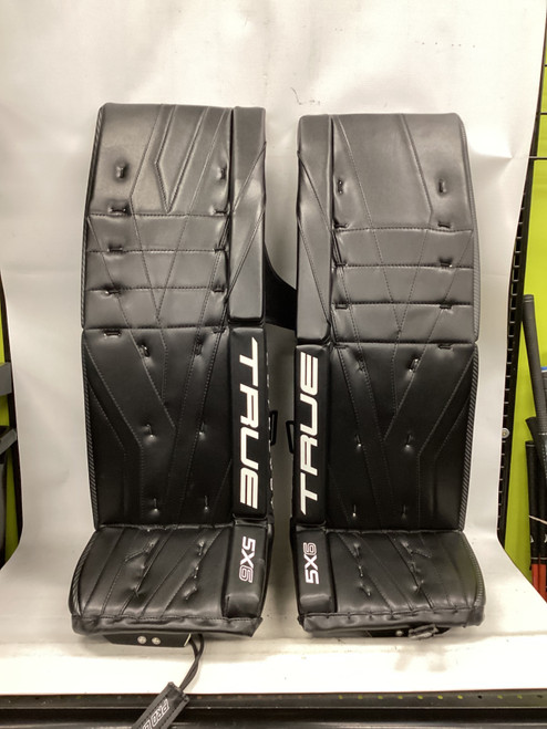 Vist Large View of Product Image Which is Used True CATALYST 5X6 Goalie Leg Pads Senior Black 34"