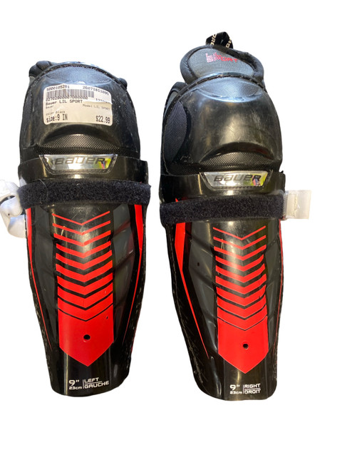 Vist Large View of Product Image Which is Used Bauer LIL SPORT Junior Shin Guards Black 9"
