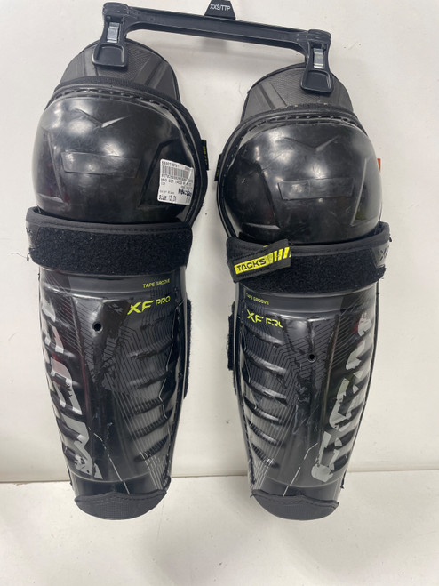 Vist Large View of Product Image Which is Used CCM TACKS XF PRO Junior Shin Guards Black 12"