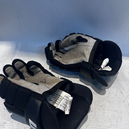 Vist Large View of Product Image Which is Used Warrior BLACK Lacrosse Gloves Junior Black 18"