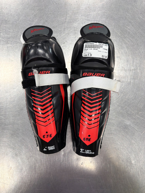Vist Large View of Product Image Which is Used Bauer LIL SPORT Youth Shin Guards Black 9"
