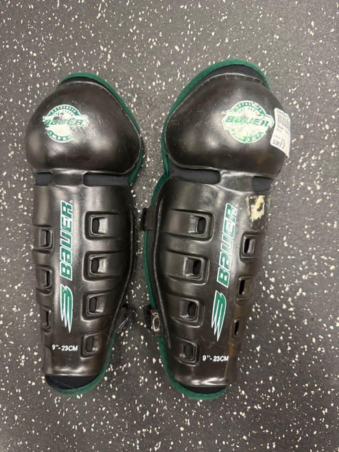 Vist Large View of Product Image Which is Used Bauer Youth Shin Guards Black 9"