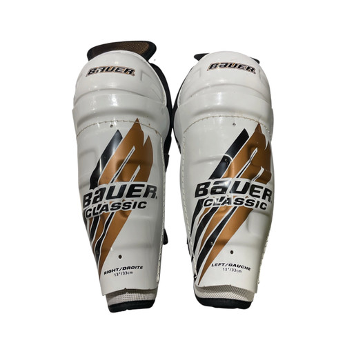 Vist Large View of Product Image Which is Used Bauer CLASSIC Intermediate Shin Guards White 13"