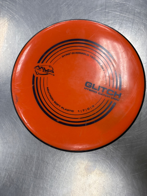 Vist Large View of Product Image Which is Used MVP NEUTRON SOFT GLITCH Disc Golf Putter Orange