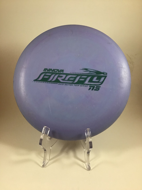 Vist Large View of Product Image Which is Used Innova NEXUS FIREFLY Disc Golf Putter Purple 172g