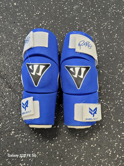 Vist Large View of Product Image Which is Used Warrior RABIL NEXT Lacrosse Arm Pads/Guards Royal Blue Senior