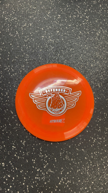 Vist Large View of Product Image Which is Used Dynamic Discs DEFENDER Disc Golf Mid Range Orange