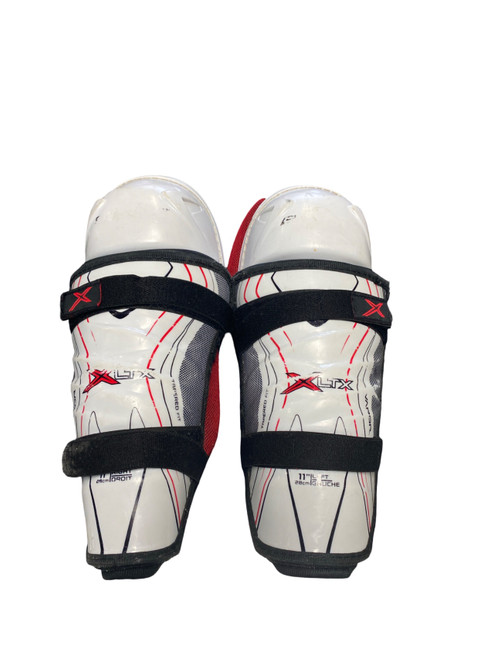 Vist Large View of Product Image Which is Used Bauer XLTX Junior Shin Guards White 11"