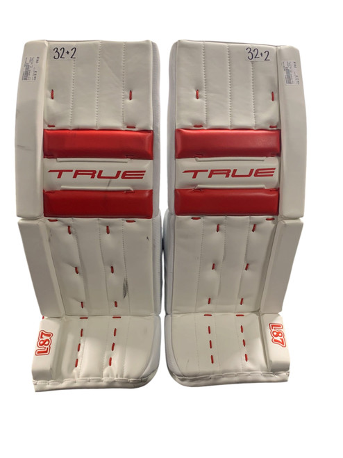 Vist Large View of Product Image Which is Used True CATAYST L87 Goalie Leg Pads Senior White And Red 32+2”