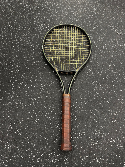 Vist Large View of Product Image Which is Used Prince COMPOSITE Adult Tennis Racquet Black 4 1/4"