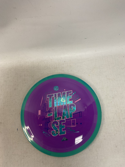 Vist Large View of Product Image Which is Used Axiom TIMELAPSE Disc Golf Driver Purple