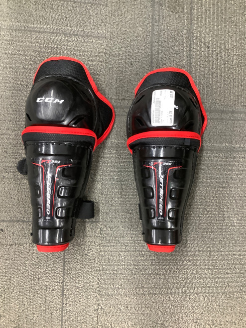 Vist Large View of Product Image Which is Used CCM FT350 Youth Shin Guards Black 8"