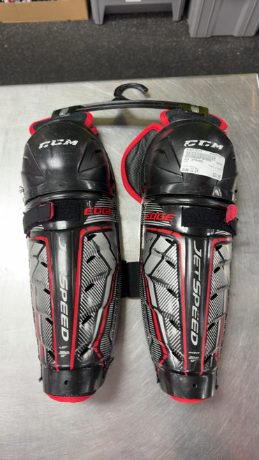 Vist Large View of Product Image Which is Used CCM JETSPEED Junior Shin Guards Black 12"