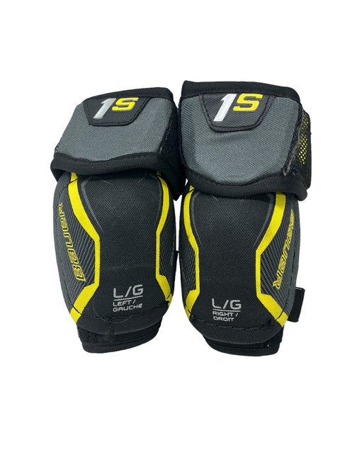 Vist Large View of Product Image Which is Used Bauer 1S Youth Elbow Pads Black LG