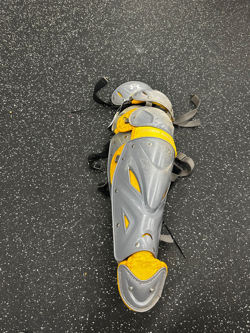 Vist Large View of Product Image Which is Used Under Armour UALG2-AL Catchers Leg Guards Gold Adult