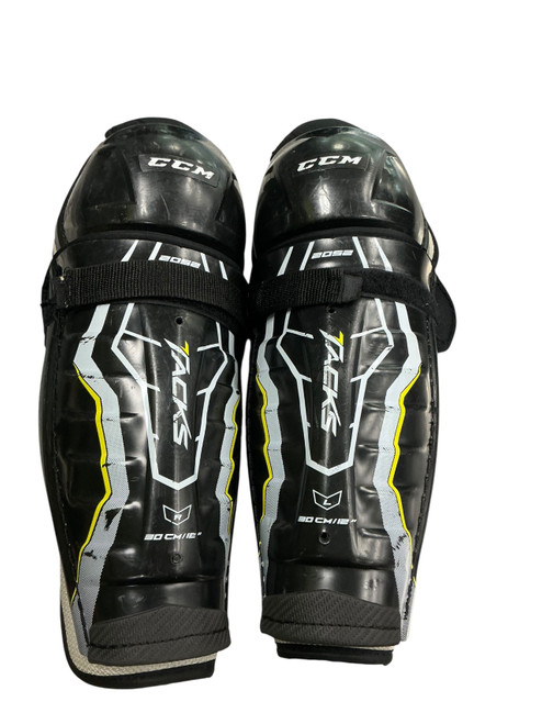 Vist Large View of Product Image Which is Used Bauer TACKS 2052 Junior Shin Guards Black 12"