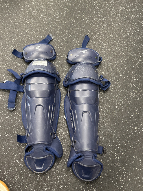 Vist Large View of Product Image Which is Used Easton BLACK MAGIC SHINS Catchers Leg Guards Navy Blue Junior