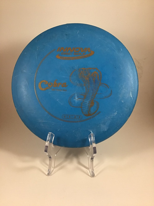 Vist Large View of Product Image Which is Used Innova DX COBRA Disc Golf Mid Range Royal Blue 172g