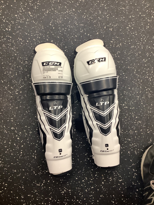Vist Large View of Product Image Which is Used CCM LTP Junior Shin Guards White 11"