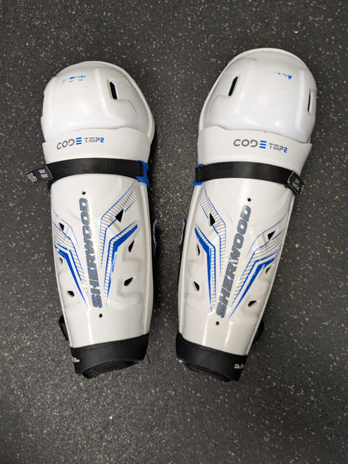 Vist Large View of Product Image Which is Used Sher-wood CODE TMP2 Intermediate Shin Guards White 13"