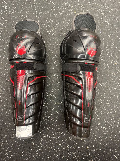 Vist Large View of Product Image Which is Used CCM QLT230 Junior Shin Guards Black 12"