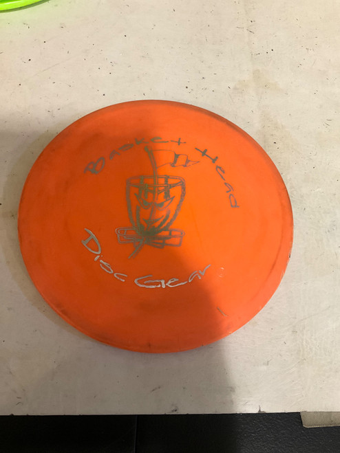 Vist Large View of Product Image Which is Used BASKET HEAD DISC GEAR Disc Golf Mid Range Orange