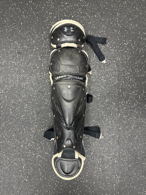 Vist Large View of Product Image Which is Used Under Armour UAGLG2-JRVS Catchers Leg Guards Black Junior