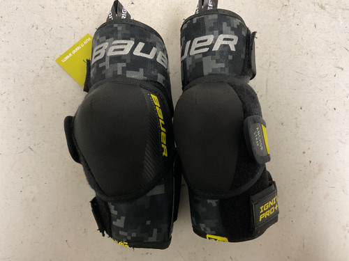 Vist Large View of Product Image Which is Used Bauer SUPREME IGNITE PRO+ Junior Elbow Pads Black And Yellow SM