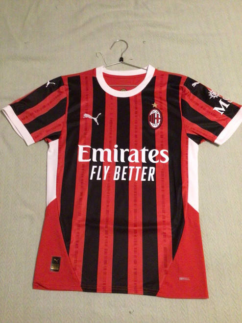 Vist Large View of Product Image Which is NEW Puma AC MILAN PULISIC JERSEY Soccer Top Adt Red And Black SM