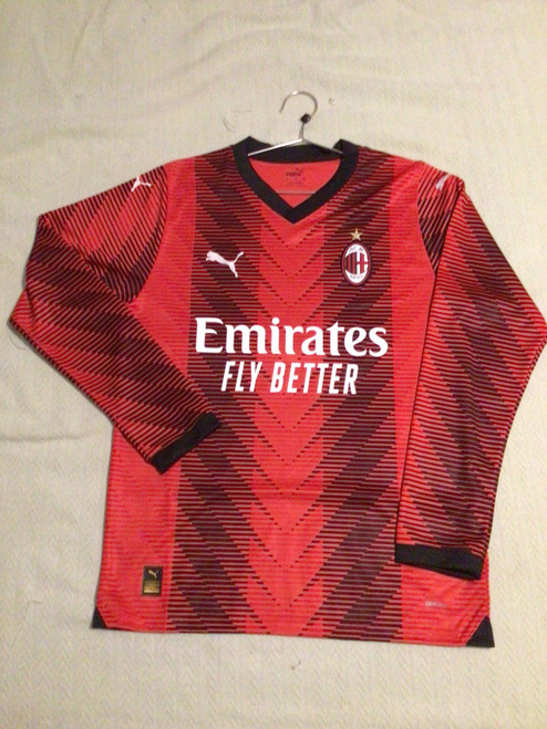Vist Large View of Product Image Which is NEW Puma AC MILAN PULISIC JERSEY LS Soccer Top Adt Red And Black MD