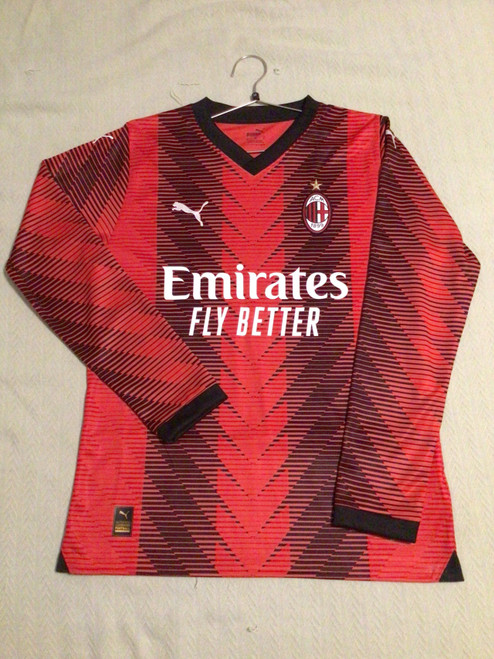 Vist Large View of Product Image Which is NEW Puma AC MILAN PULISIC JERSEY LS Soccer Top Adt Red And Black MD